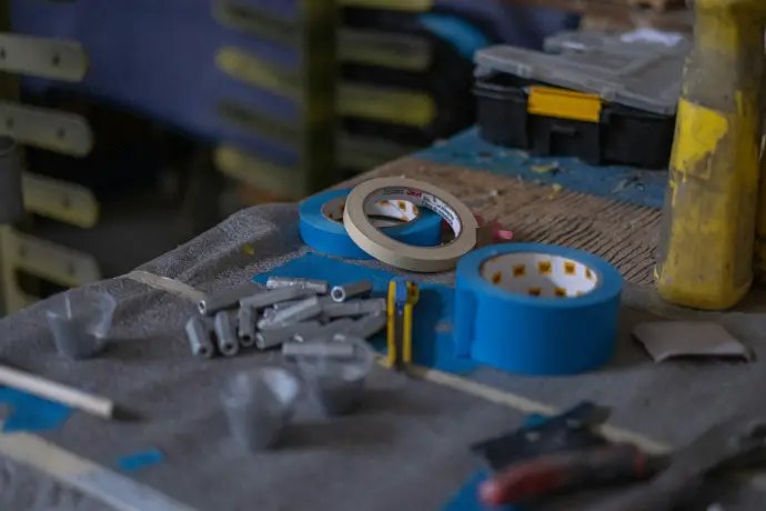 A table topped with lots of tools on top of a table